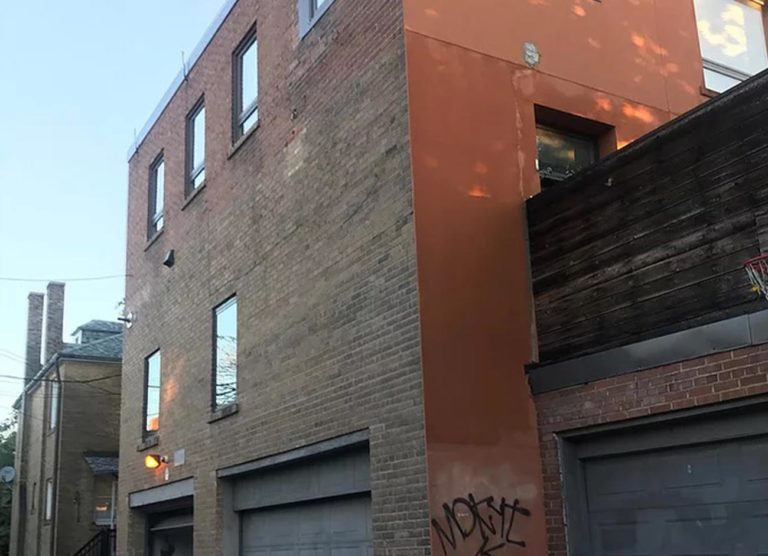 Brick buildings along a downtown Toronto laneway