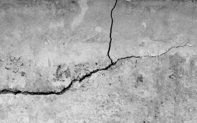 Visible damage indicating a concrete foundation may need repair