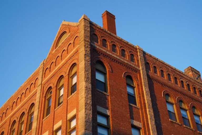 Historic red brick building with arched windows